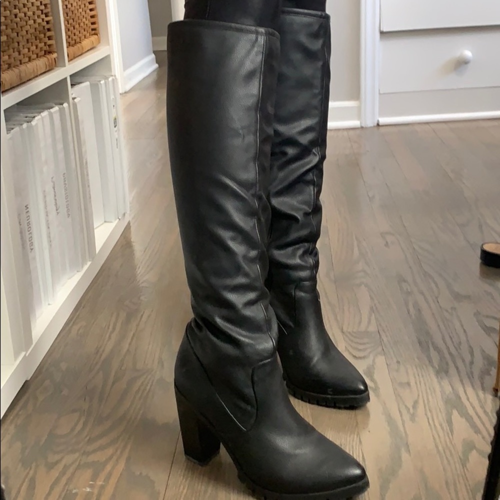 Tall heeled black boots